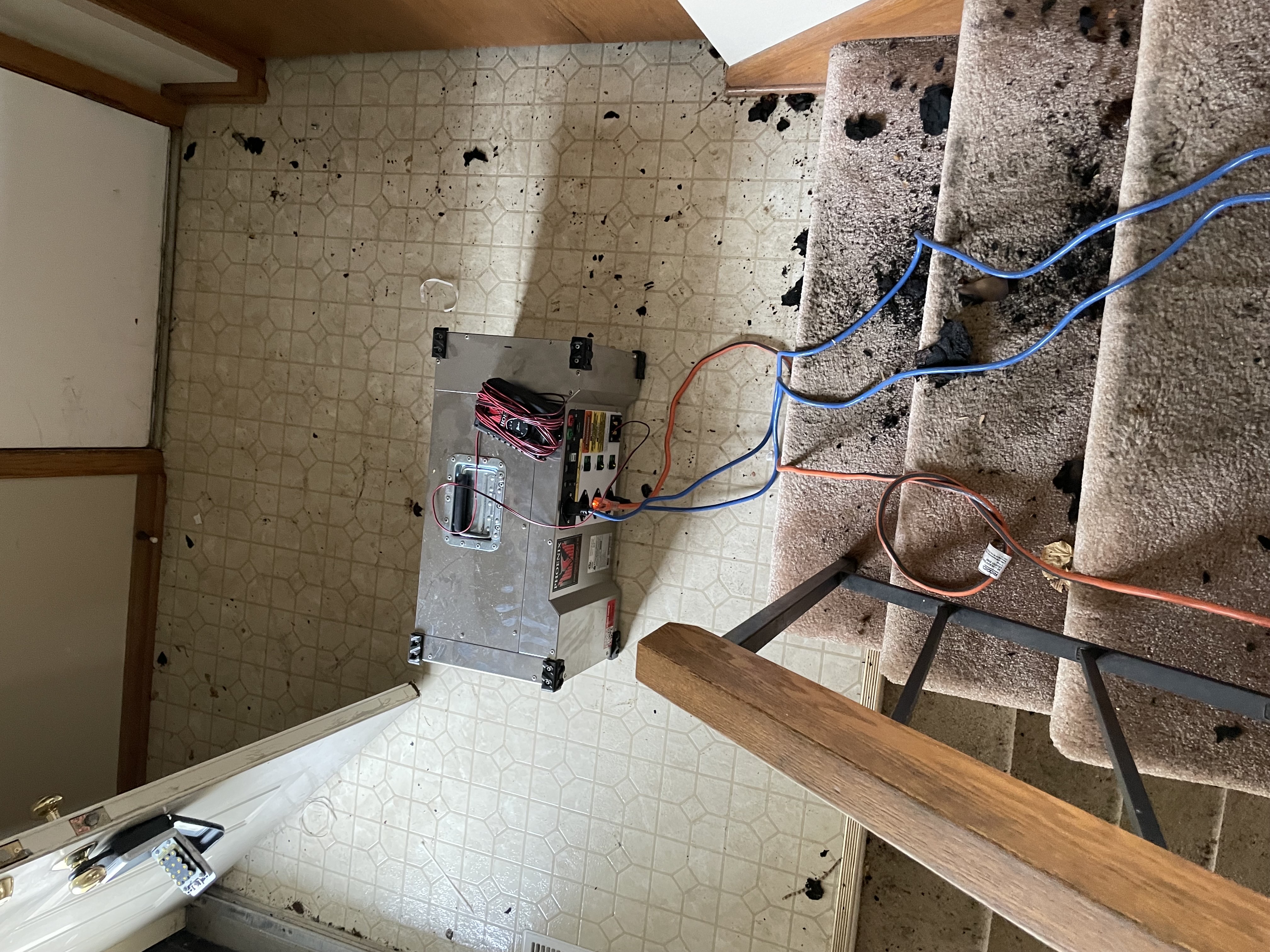 Water damage restoration equipment on damaged stairs in Maple Lake